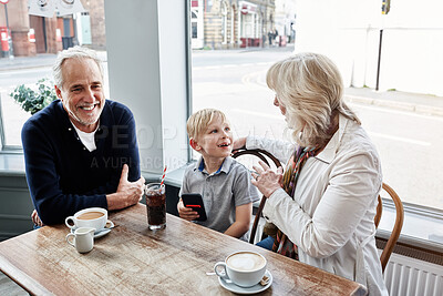 Buy stock photo Happy and family, grandparents with kid at cafe for conversation, talking of holiday visit in London. Senior people with boy or child at coffee shop for discussion, funny chat and planning at table