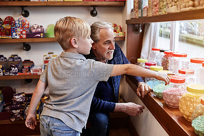 Buy stock photo Man, child and jar candy store with point for gift, shopping and choice with love, care and bonding. Grandfather, boy kid and retail shop with container for sweets, decision and present with family