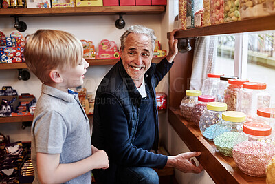 Buy stock photo Man, child and jar candy shop with question for gift, shopping and choice with love, care and bonding. Grandfather, boy kid and retail store with container for sweets, decision or present with family