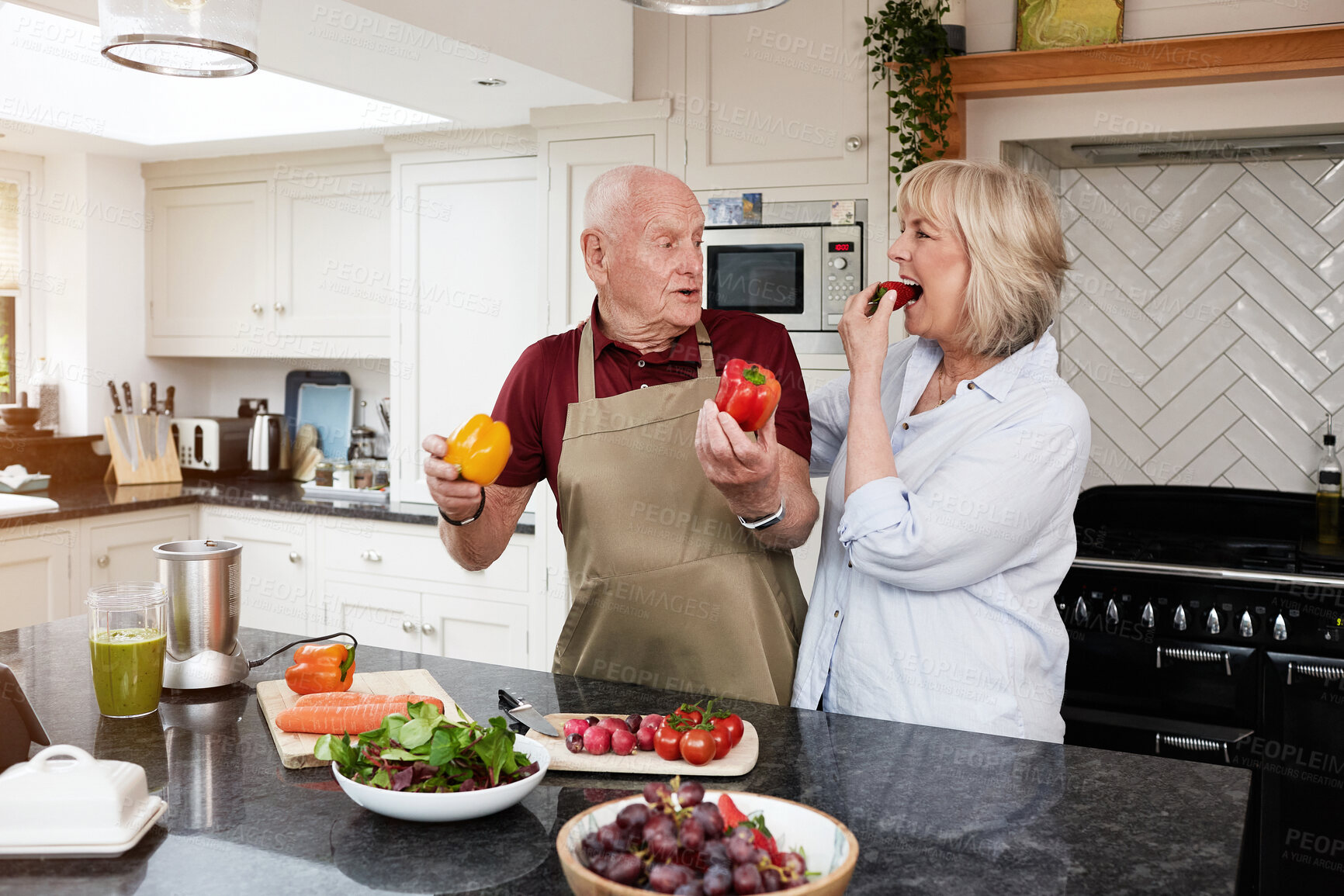Buy stock photo Cooking, love and senior couple in a kitchen with care, fun and bonding at home. Health, food and hungry old people with vegetables for meal prep, brunch or detox, weight loss or vegan lunch salad 