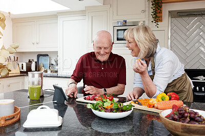 Buy stock photo Internet, cooking and senior couple with a tablet, online recipe and digital app with instructions, vegetables or home. Kitchen, elderly man or old woman with technology, conversation or healthy food