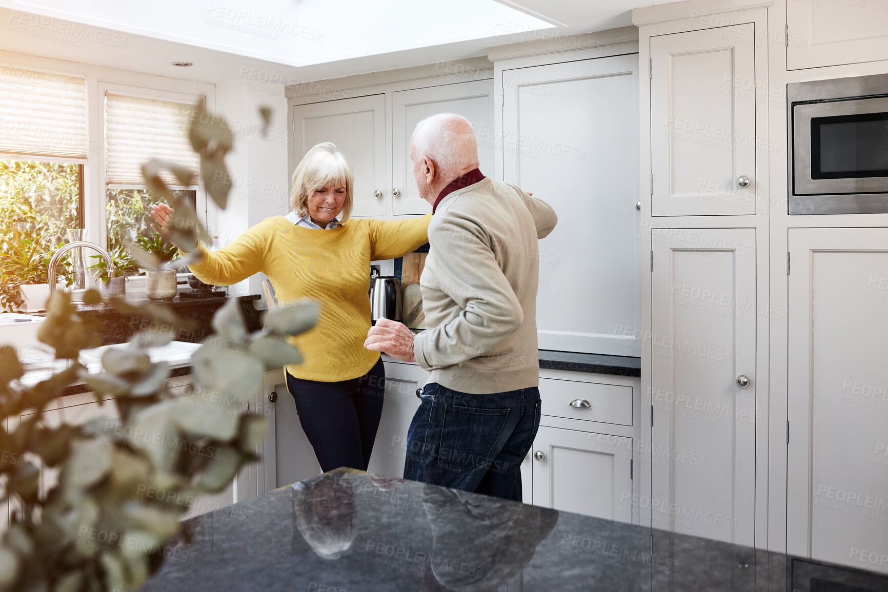 Buy stock photo Dance, happy and senior couple on a kitchen room with music, love and bonding in their home. Retirement, celebration and old people in a house with radio, podcast or fun with care, trust or support