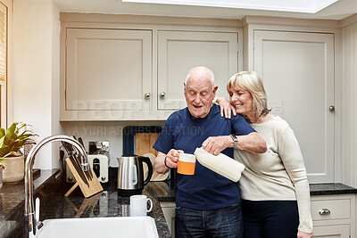 Buy stock photo Senior, couple and pouring milk in kitchen with smile for coffee, break or beverage in the morning at home. Elderly, man and woman with tea for breakfast, happiness and bonding in house or apartment