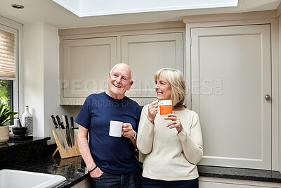 Buy stock photo Coffee, smile and senior couple in kitchen at home together in the morning for conversation, love and healthy connection. Tea cup, happy and elderly man and woman enjoying drink in mug in retirement.