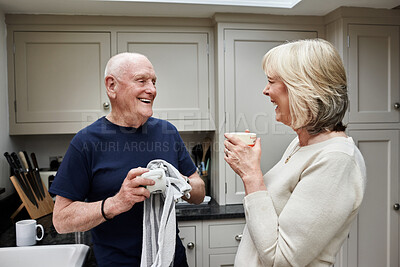 Buy stock photo Senior couple, cleaning dishes and kitchen with conversation, coffee and laugh for funny memory in home. Elderly woman, old man and cloth for hygiene, chat or drink with tea cup, retirement and house