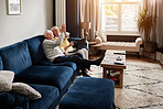 High five, relax and retirement with a senior couple on a sofa in the living room of their home for conversation. Love, smile or support with a happy elderly man and woman talking in their apartment