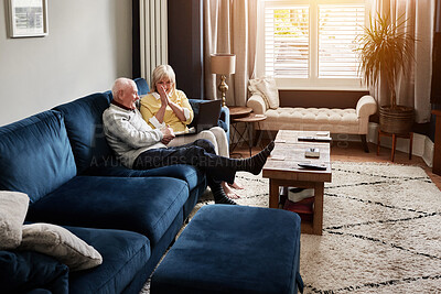 Buy stock photo Laptop, relax and retirement with a senior couple on a sofa in the living room of their home for entertainment. Computer, video or happy with an elderly man and woman streaming in their apartment