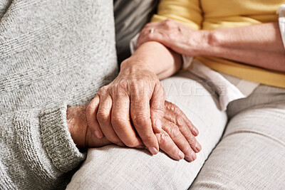 Buy stock photo Senior couple, love and holding hands for trust, loyalty and support with gratitude, empathy and care at home. Closeup, partner and helping hand for kindness, healing and hope in retirement together 