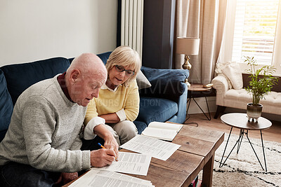 Buy stock photo Couple, retirement and writing documents in home for planning budget, financial assets and sign legal contract of insurance policy. Senior man, woman and paperwork for information, bank loan or taxes