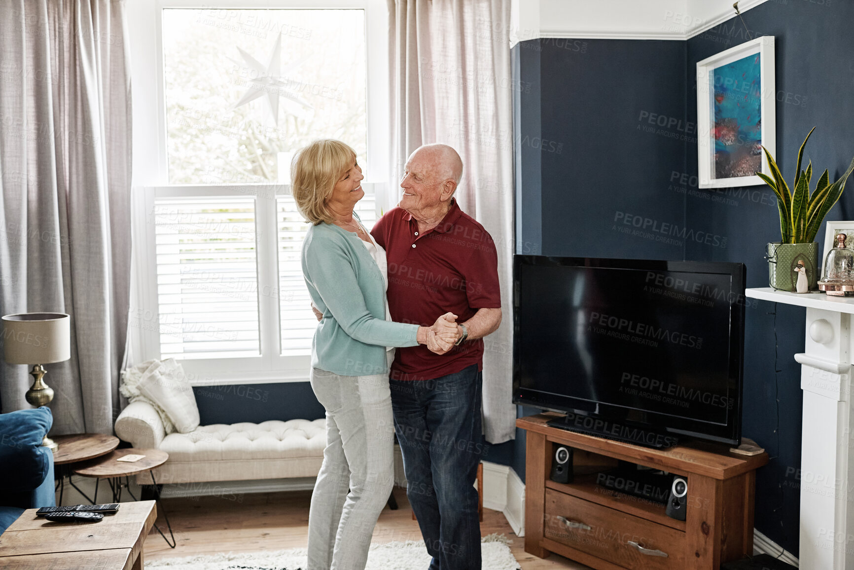 Buy stock photo Happy, dance and senior couple on a living room with music, love and bonding in their home. Retirement, celebration and old people in a lounge with radio, podcast or fun with care, trust or support