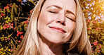Happy, nature and mature woman in sunshine by the trees in outdoor park, field or garden. Happy, calm and peaceful female person from Canada by green leaves and plants for fresh air and daydreaming.