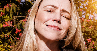 Buy stock photo Happy, nature and mature woman in sunshine by the trees in outdoor park, field or garden. Freedom, calm or peaceful female person from Canada by green leaves and plants for fresh air and daydreaming.