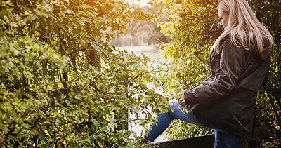 Buy stock photo Countryside, fence and woman in nature walking for wellness, fresh air and relax outdoors. Trees, health and person in field, meadow and farm for adventure, peace and freedom in natural environment