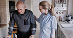 Medical, help and nurse with senior man in a nursing home kitchen with crutches and consultation. Healthcare, career and female caregiver with elderly male patient in retirement at modern house.