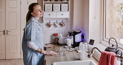 Buy stock photo Thinking, apron and home with woman in a kitchen, ideas and bored with daydreaming, peaceful and maid. Person, girl and caregiver with solutions, problem solving and planning with decision and choice