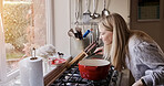 Woman, smell and cooking at stove pot or warm winter meal, stew dinner or smile in kitchen. Female person, gas appliance or prepare nutrition eating as soup diet for fresh taste, love home or healthy