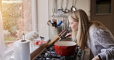 Buy stock photo Woman, smell and cooking at stove pot or warm winter meal, stew dinner or smile in kitchen. Female person, gas appliance or prepare nutrition eating as soup diet or fresh taste, hungry health in home