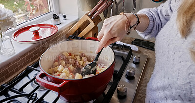 Buy stock photo Hands, cooking and stirring in pot, closeup and healthy meal on gas stove, mixing and diet in kitchen. Fingers, person and nutrition in food, prepare ingredients and kitchenware or lunch at home