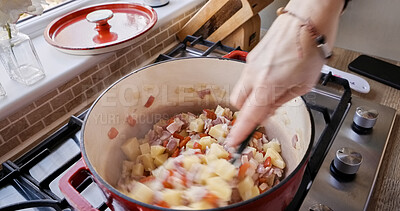 Buy stock photo Hands, cooking and stirring in pot, closeup and healthy meal on gas stove, mixing and diet in kitchen. Fingers, person and nutrition in food, prepare ingredients and kitchenware or lunch at home