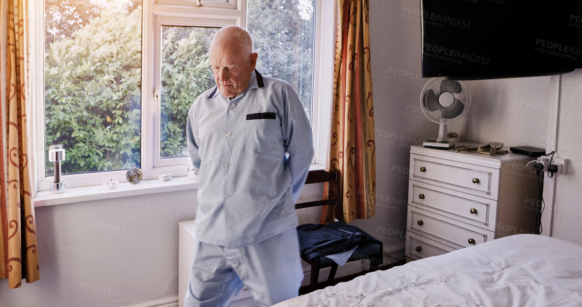 Buy stock photo Morning, retirement and senior man in bedroom for wake up, start and getting ready for the day. Thinking, house and elderly person by window with nostalgia, reflection and memory of past in home
