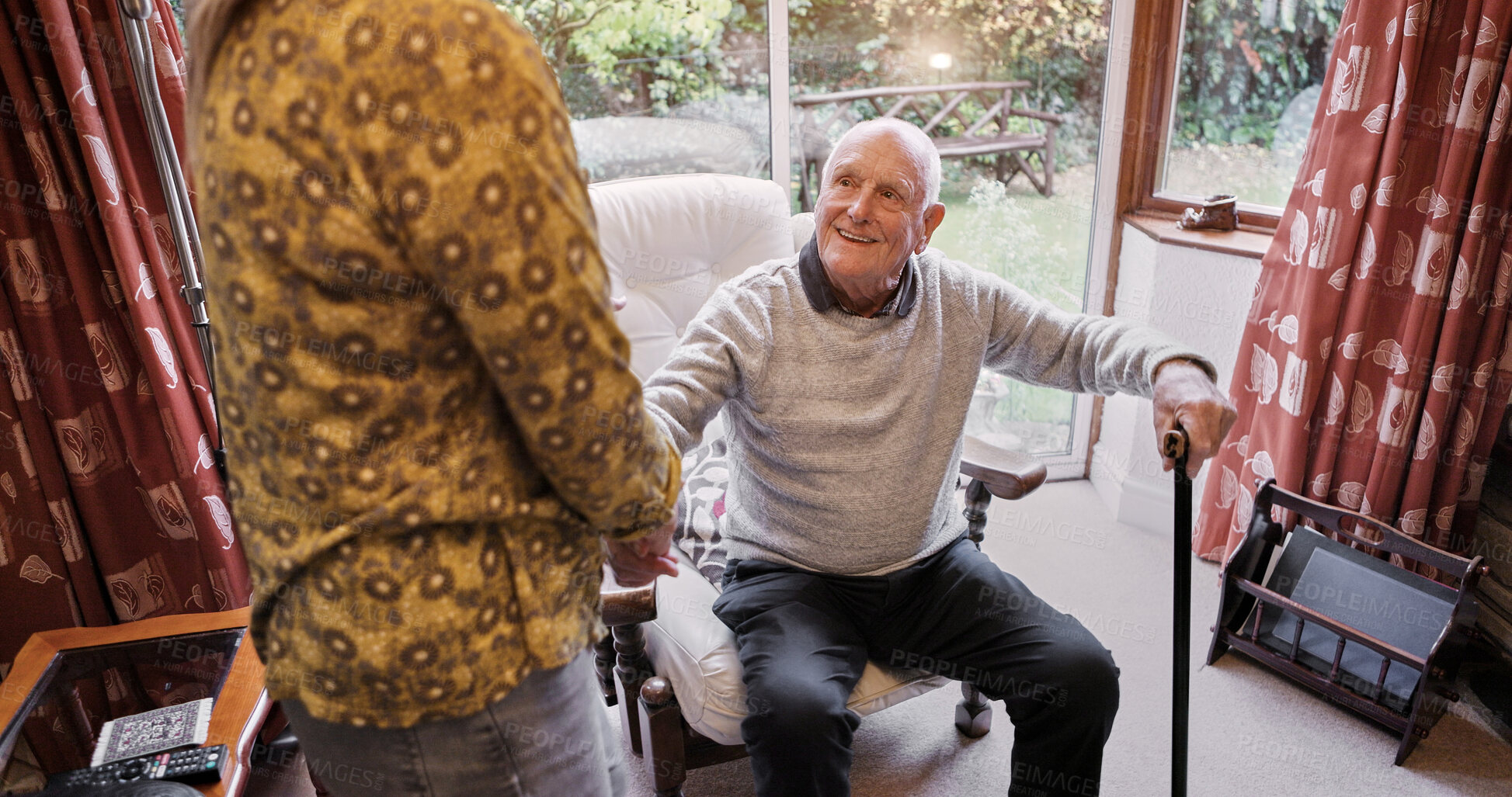 Buy stock photo Old man, talking and relax in home with caregiver in retirement with walking stick and support. Senior, person and conversation with woman in apartment, living room and house with care and discussion
