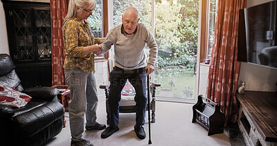 Buy stock photo Senior, couple and support with walking stick for care, help or assistance on sofa in living room of home. Elderly, woman or man with disability or cane in lounge of retirement with love and recovery