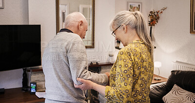 Buy stock photo Love, help and senior couple in a living room with balance, support or walking in nursing home together. Mobility, care or elderly people in a lounge for stroke recovery, standing or healing activity
