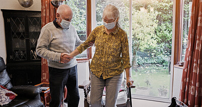 Buy stock photo Senior, couple and help or walking stick with mask, support or assistance for covid in living room of home. Elderly, man or woman and disability or cane in lounge of retirement with love and recovery