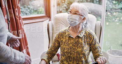 Buy stock photo Senior, woman and living room or mask virus for protection or husband, compliance for health care. Old people, pandemic management for illness cooperation in home for marriage, empathy or quarantine