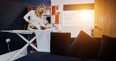 Buy stock photo Iron, clothes and woman in morning with laundry, cleaning and steam fabric on board. Ironing, table or cleaner working in apartment, home or living room with housekeeping service or care for clothing