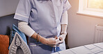 Hands, iron and getting ready with a person in the home for spring cleaning, housework or chores. Clothes, dressing and morning routine with an adult using an appliance in the apartment closeup