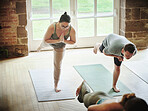 People, yoga and class in balance exercise, workout or stretching for health and wellness together at gym or dojo. Yogi group in warm up, body stretch or fitness for indoor pilates lesson or session