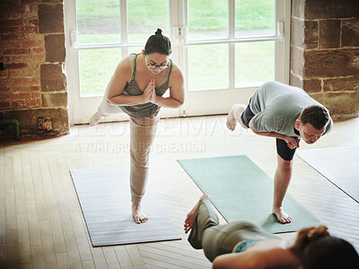Buy stock photo People, yoga and class in balance exercise, workout or stretching for health and wellness together at gym or dojo. Yogi group in warm up, body stretch or fitness for indoor pilates lesson or session