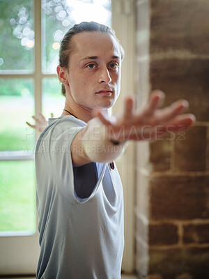 Buy stock photo Man, yoga and pilates for fitness, workout or exercise in warrior pose for health and wellness at gym or dojo. Face of male person or yogi posing in relax for posture, spiritual awareness or balance