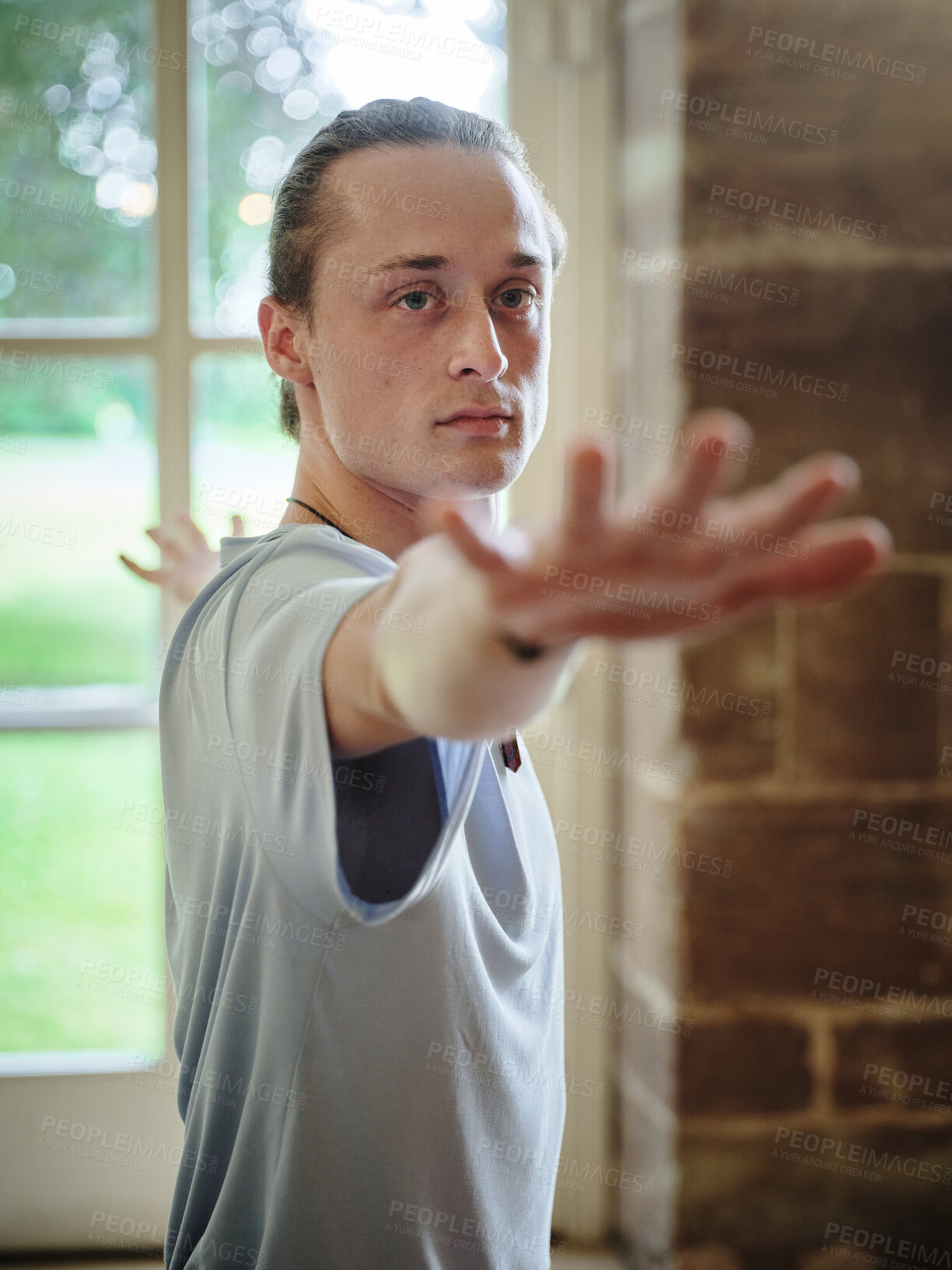 Buy stock photo Man, yoga and pilates for fitness, workout or exercise in warrior pose for health and wellness at gym or dojo. Face of male person or yogi posing in relax for posture, spiritual awareness or balance