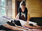 Yoga, personal trainer and people stretching in class for fitness, exercise and wellness in studio. Health club, childs pose and instructor with group for flexibility workout, balance and training