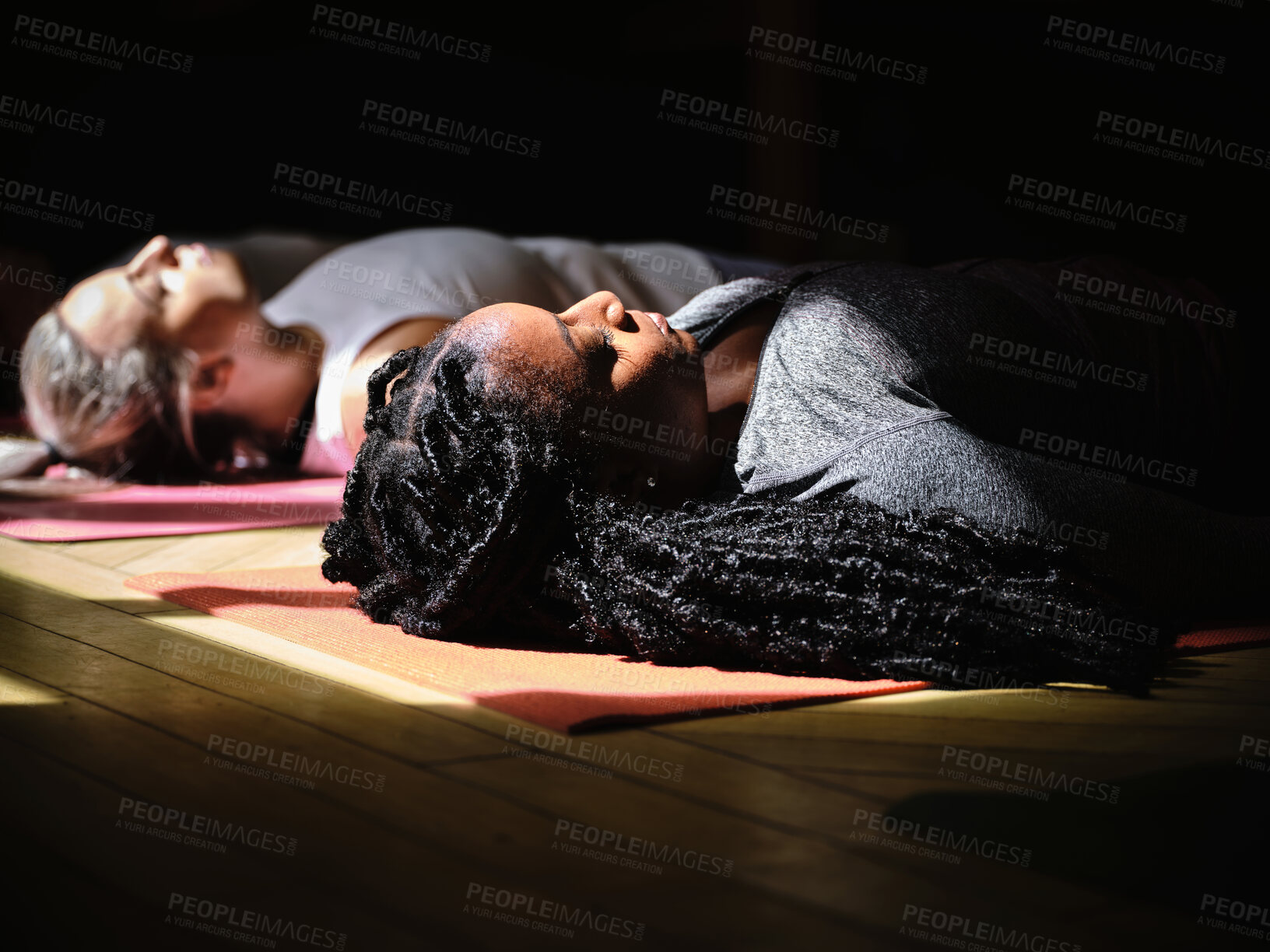 Buy stock photo Meditation, yoga and woman in dead pose at gym, relax and peace in mindfulness. Zen, calm person and corpse body exercise on floor, breathe for fitness and wellness, health or rest to sleep in class