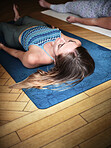 Meditation, yoga and woman in corpse pose at gym, relax or peace in mindfulness class. Zen, calm person and savasana body exercise on floor, breathing for fitness or wellness, health or sleep to rest