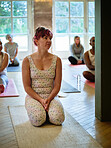Yoga class, wellness and woman for pilates exercise in a zen studio gym for body, spiritual and mind balance. Fitness, calm and female person for meditation workout with group in community hall.