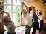 Yoga studio, stretching and woman in class, exercise and health for wellness and flexibility. Serious, mind and holistic on floor, mindfulness and active for body, pilates and core balance with arms

