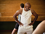 Men, group or people learning in yoga class for meditation or body flexibility in zen studio together. Peace, start or calm person in pilates stretching neck for balance, energy or wellness to relax