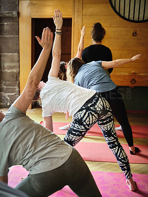 Buy stock photo Yoga class, stretching and woman in studio, exercise and health for wellness and flexibility. Serious, mind and holistic on floor, mindfulness and active for body, pilates and core balance with arms
