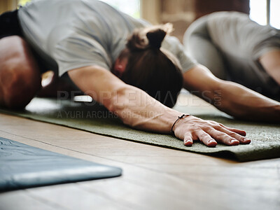 Buy stock photo Man, yoga and class in exercise, workout or fitness for stretching, health and wellness in childs pose at gym. Yogi group in warm up, body stretch or session together for indoor pilates or lesson