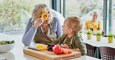 Buy stock photo Play, grandmother or child cooking for lunch, vegetables or nutrition with wellness in family home. Games, grandparents or happy kid with elderly grandma, smile or food for health, care or wellness