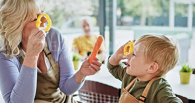 Buy stock photo Kitchen vegetables, fun and family cooking nutrition food, home recipe or teaching child to prepare clean eating snack. Nutritionist, grandma and young kid, boy or grandson play with meal ingredients