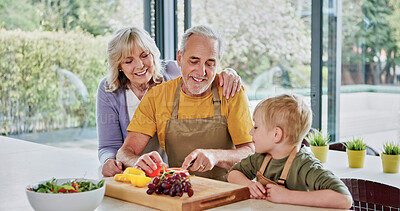 Buy stock photo Teaching, grandparents or child cooking for lunch, vegetables or nutrition with love in family home. Fruits, happy grandfather or kid with elderly grandma, smile or food for health, care or learning