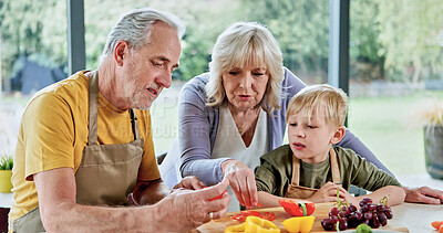 Buy stock photo Healthy, grandparents or child cooking for lunch, vegetables or nutrition with love in family home. Fruits, senior grandfather or kid with elderly grandma, care or food for diet, teaching or learning