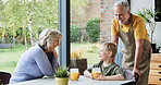 Happy, home and grandparents with child talking for bonding, relationship and relax on weekend. Retirement, family and grandma, grandpa and young boy sitting for conversation, chat and speaking