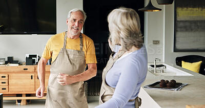 Buy stock photo Senior couple, cooking and talking in a home with retirement and marriage with discussion and love. Support, care and elderly people together with conversation and happy from dinner and helping