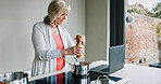 Cooking, woman and laptop in kitchen with recipe, online website and food planning in a home. Stove, web and house with computer and pepper with meal and dinner with internet and vegan diet ideas